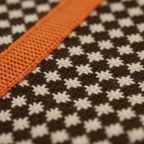 Cotton Turtleneck with Cross Pattern and Orange Sleeves